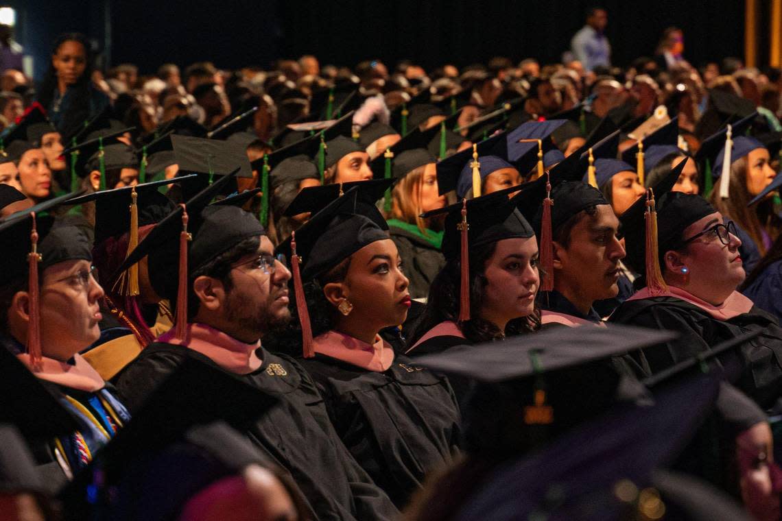 Florida International University graduates watch as commencement takes place in the Ocean Bank Convocation Center at the Modesto A. Maidique Campus in Miami on Tuesday, Dec. 13, 2022.