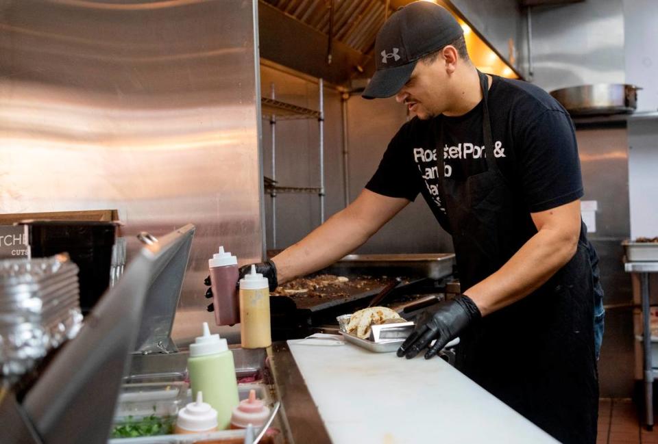 Shawn Carter makes an order of tacos at Carter’s Table on Wednesday, March 22, 2023.