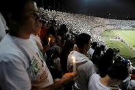 Fans of Atletico Nacional soccer club pay tribute to the players of Brazilian club Chapecoense killed in the recent airplane crash, in Medellin, Colombia, November 30, 2016. REUTERS/Fredy Builes