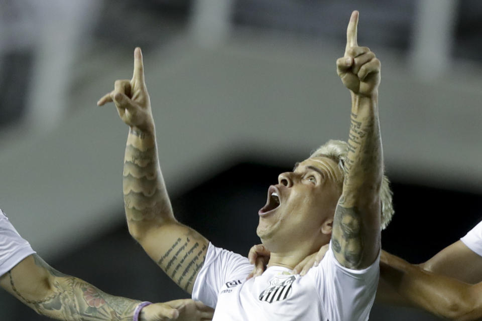 Soteldo of Brazil's Santos celebrates scoring his side's second goal against Argentina's Boca Juniors during a Copa Libertadores semifinal second leg soccer match in Santos, Brazil, Wednesday, Jan. 13, 2021. (AP Photo/Andre Penner, Pool)