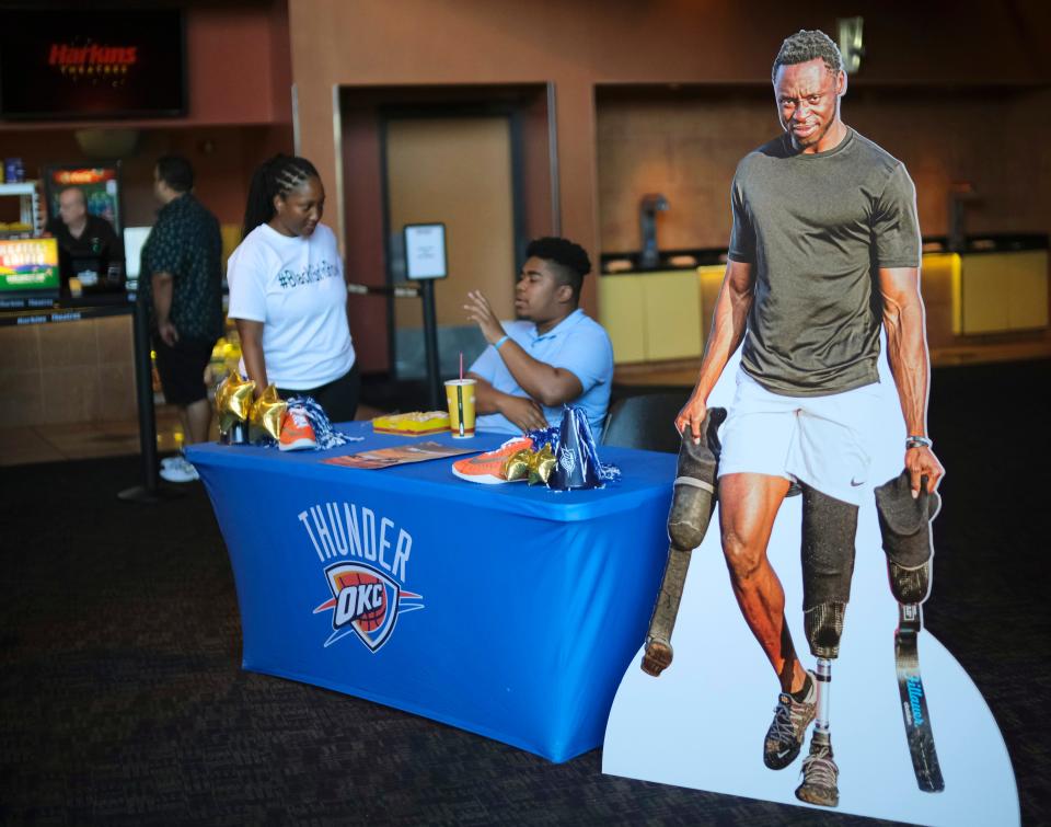 A promotional cutout for the OKC Thunder Films short film "Steps" depics Derek Loccident, a former University of Central Oklahoma football player whose foot was severed in a train accident, at the Harkins Theater during the opening day of deadCenter Film Festival in Oklahoma City, Thursday, June 8, 2023.