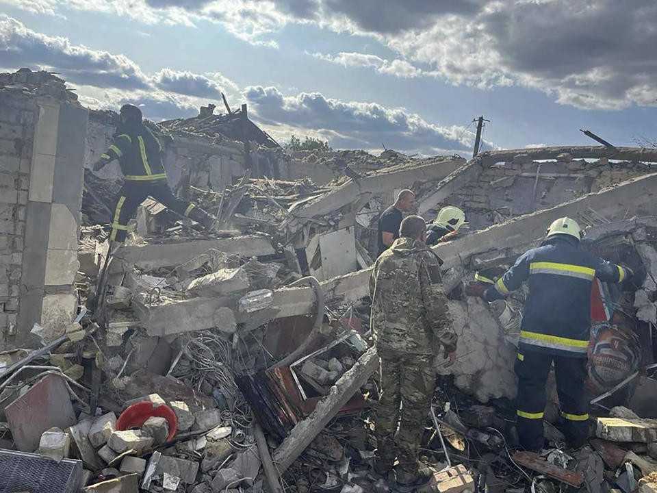 In this photo provided by the Ukrainian Presidential Press Office, emergency workers search the victims of a Russian rocket attack that President Volodymyr Zelenskyy said had killed at least 48 people in the village of Hroza, near Kharkiv, Ukraine, Oct. 5, 2023. / Credit: Ukrainian Presidential Press Office via AP