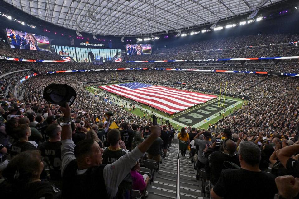 Fans cheer before a game between the Las Vegas Raiders and Green Bay Packers at Allegiant Stadium on Oct. 9.