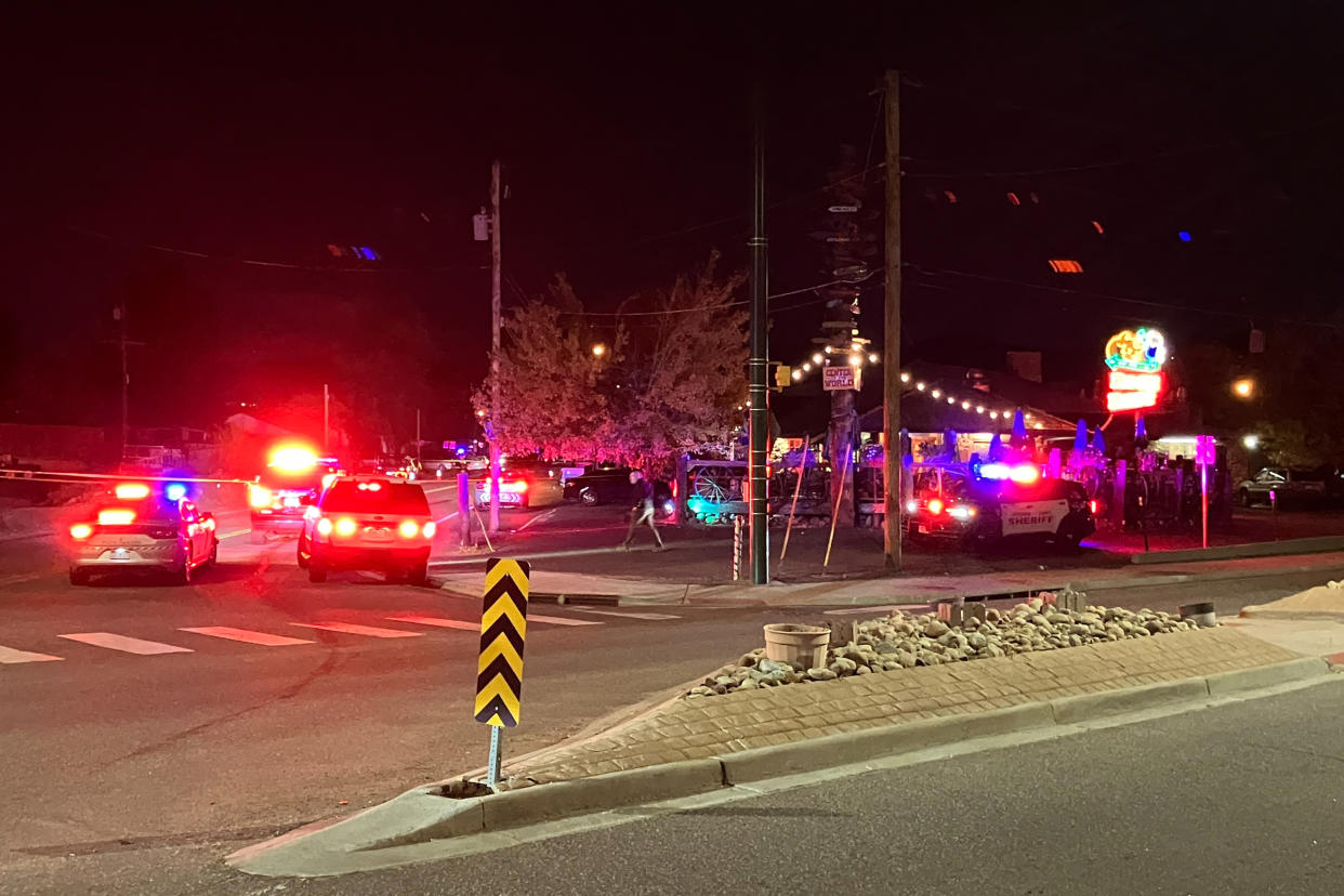 This early Sunday, Oct. 9, 2022, photo provided by the Jefferson County Sheriff's Office shows the scene of a fatal vehicle attack in Golden, Colo. Colorado authorities say a man drove a pickup truck through a crowd following an altercation outside a bar. (Jenny Fulton/Jefferson County Sheriff's Office via AP)