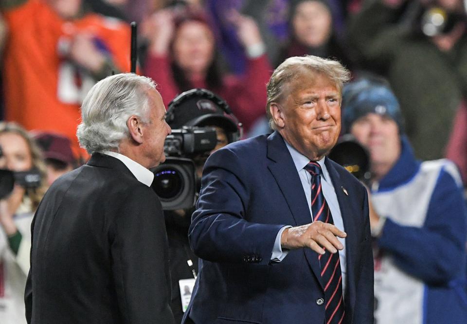 Donald Trump, former 45th U.S. President and 2024 U.S. President Republican candidate with SC Gov. Henry McMaster at the Clemson vs South Carolina football game Nov 25, 2023; Columbia, South Carolina, USA; at Williams-Brice Stadium.