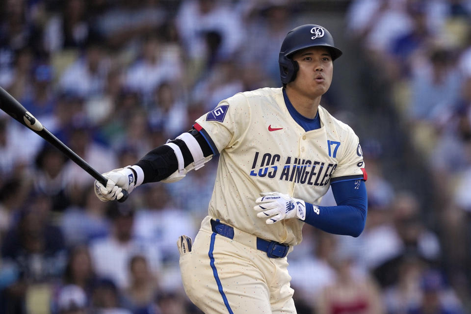 Los Angeles Dodgers' Shohei Ohtani reacts as he hits a foul ball toward a ball girl during the sixth inning of a baseball game against the Milwaukee Brewers Saturday, July 6, 2024, in Los Angeles. (AP Photo/Mark J. Terrill)