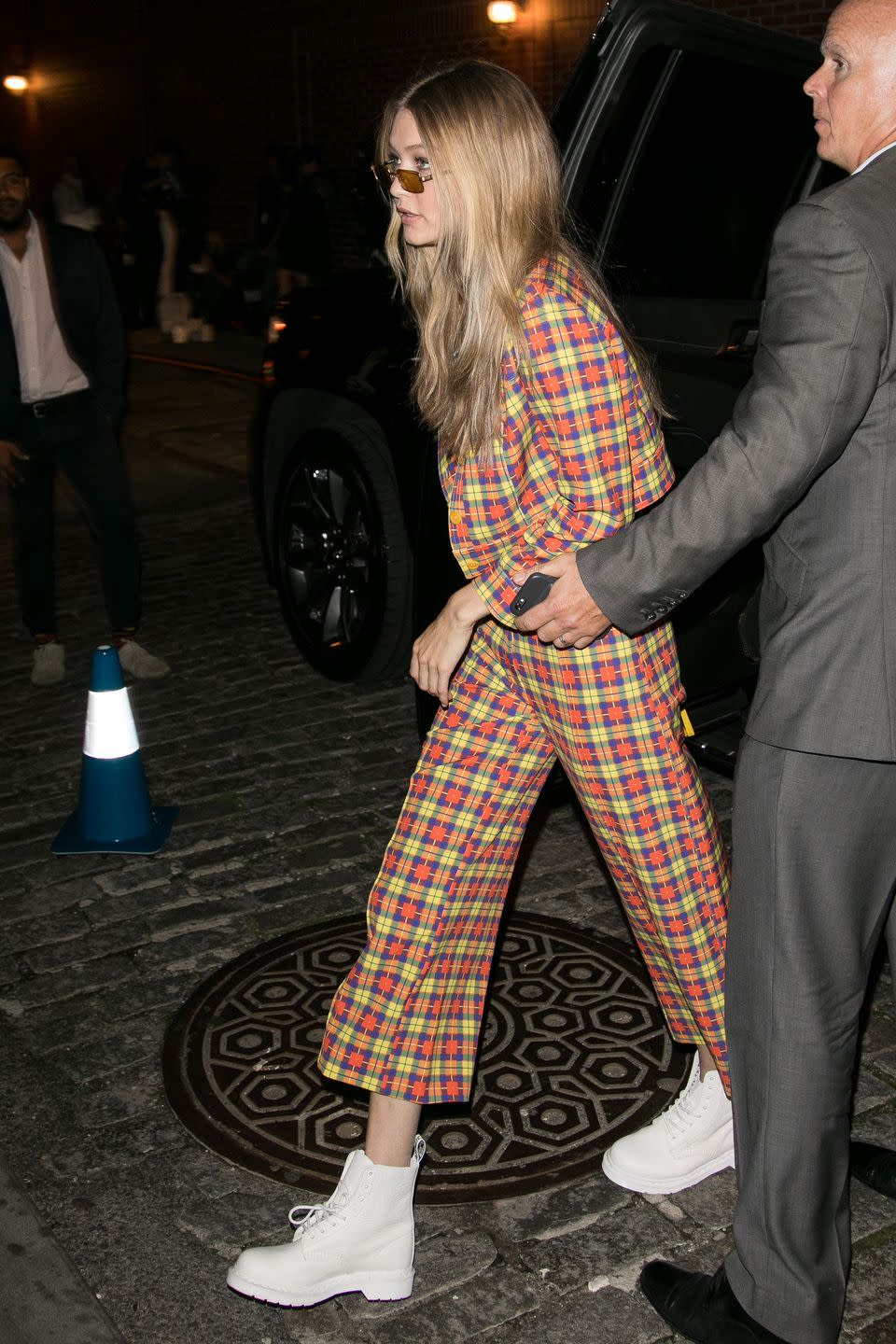 <p>In a Jeremy Scott plaid suit with white combat boots and Linda Farrow x Dries Van Noten sunglasses while out in New York City. </p>