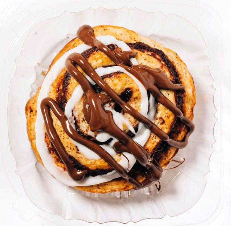 A freshly baked gourmet Nutella cinnamon roll is one customer favorite at The Peach Cobbler Factory.
