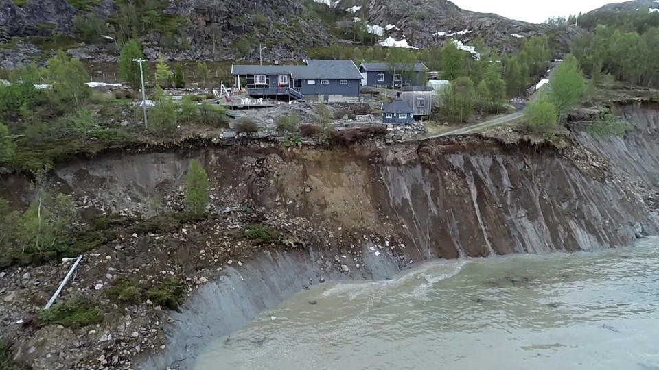 The scene of a landslide near Alta, Arctic Norway, seen Wednesday June 3, 2020, after a powerful landslide that took eight houses into the sea off northern Norway. (Anders Bjordal via AP)