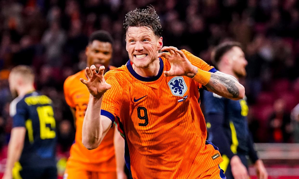 <span>Wout Weghorst celebrates after scoring the hosts’ third goal in Amsterdam.</span><span>Photograph: Rene Nijhuis/MB Media/Getty Images</span>