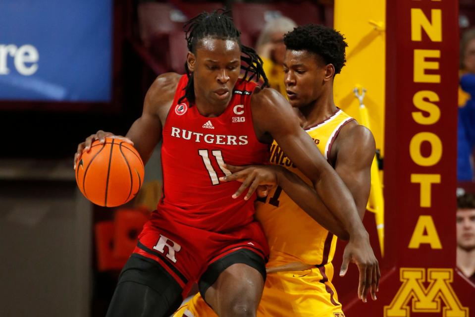 Rutgers center Clifford Omoruyi, left, work against Minnesota forward Pharrel Payne during the first half of an NCAA college basketball game Thursday, March 2, 2023, in Minneapolis. (AP Photo/Bruce Kluckhohn)