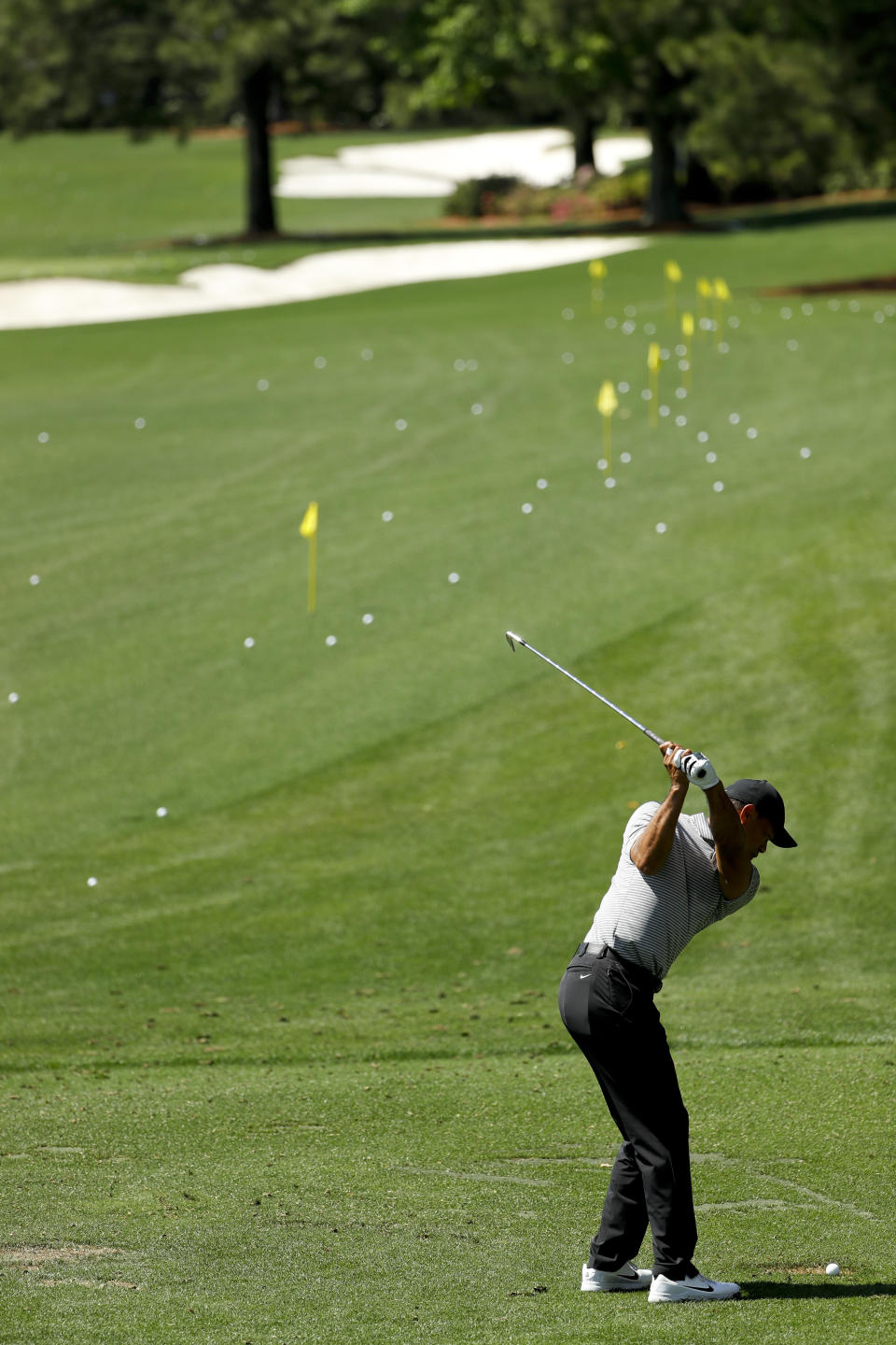 Tiger Woods hits balls in the practice area at the Masters golf tournament Tuesday, April 9, 2019, in Augusta, Ga. (AP Photo/Matt Slocum)