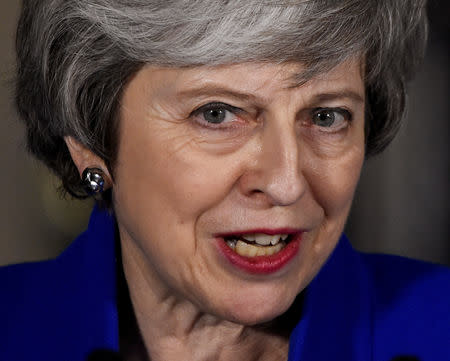 Britain's Prime Minister Theresa May makes a statement following winning a confidence vote, after Parliament rejected her Brexit deal, outside 10 Downing Street in London, Britain, January 16, 2019. REUTERS/Clodagh Kilcoyne