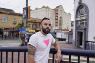 Tom Temprano poses in the Castro neighborhood of San Francisco, Thursday, July 28, 2022. Temprano was scheduled to get his second dose of the Monkeypox vaccine next week but was just notified that it is canceled because of short supply. He is frustrated that authorities have taken so long to respond, and noted they did so after LGBTQ politicians in his community raised their voices.(AP Photo/Eric Risberg)
