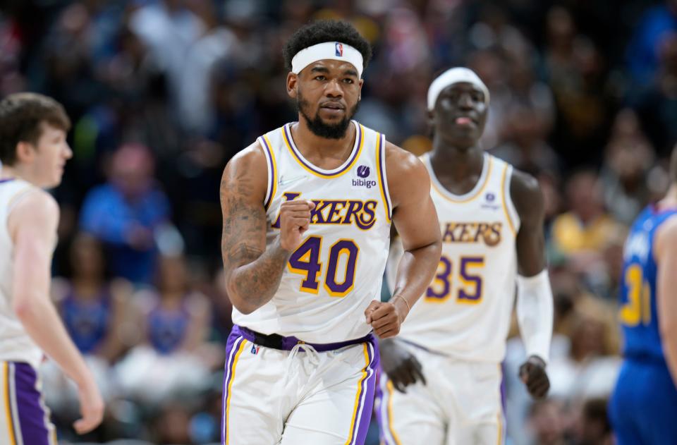 Los Angeles Lakers forward Mason Jones reacts after hitting one of two free-throw attempts to insure the lead late in overtime of an NBA basketball game against the Denver Nuggets Sunday, April 10, 2022, in Denver. (AP Photo/David Zalubowski)