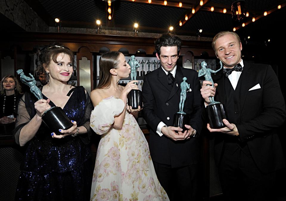 The cast of <em>The Crown </em>looked delighted to be taking home the prize for outstanding performance by an ensemble in a drama series.