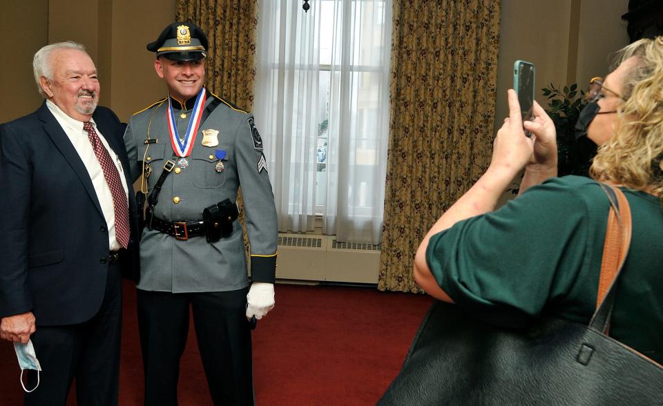 Westborough police Sgt. Jonathan Kalagher poses for a photo  with retired Westborough police Lt. Paul Donnelly.