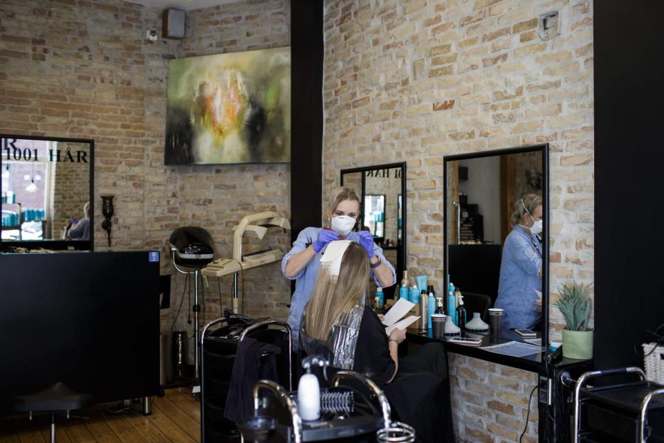 A hair salon reopens in Europe after the coronavirus lockdown (AFP via Getty Images)