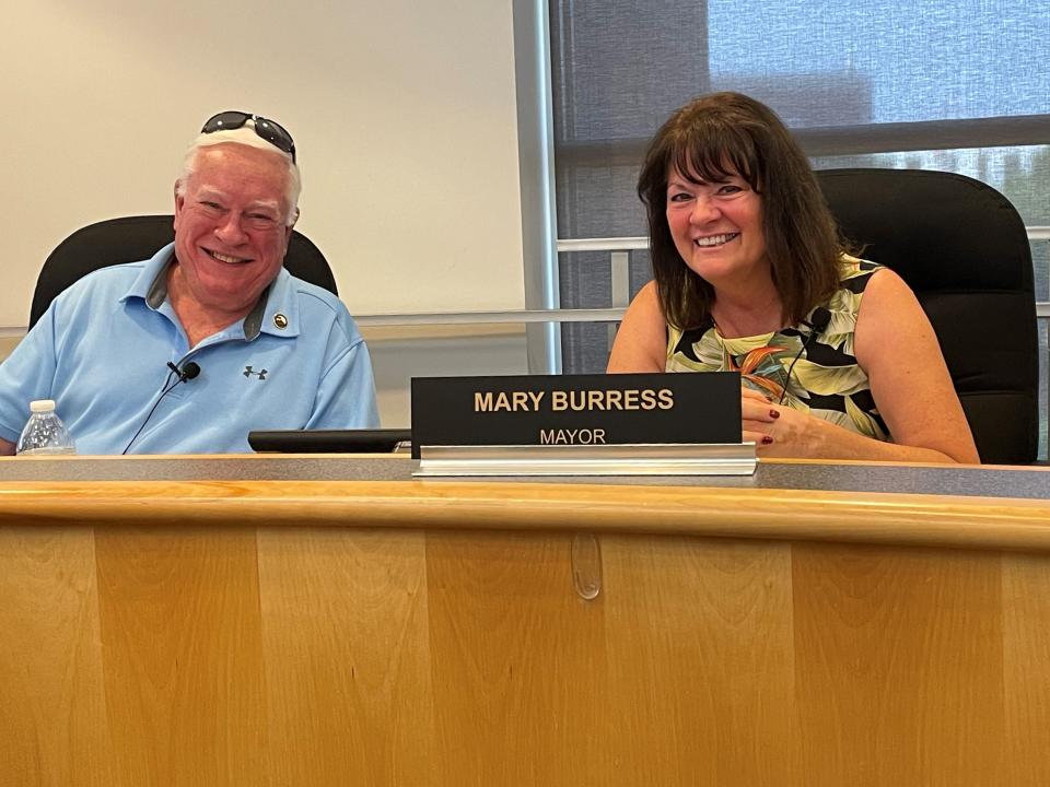 Pekin Mayor Mary Burress shares a laugh with Council member Dave Nutter before Monday's meeting. The Council passed two major infrastructure projects during the meeting.