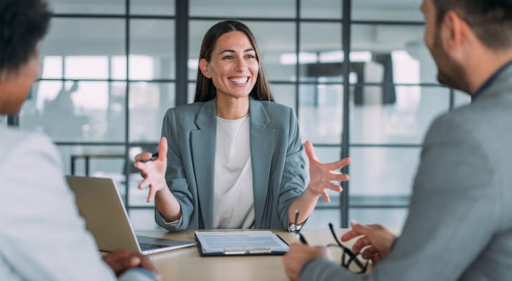 A financial advisor meets with a pair of married clients.