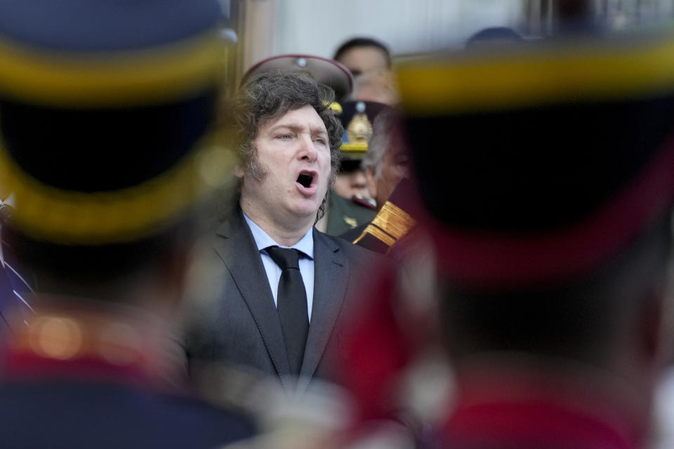 Argentine President Javier Milei sings the national anthem during the official ceremony commemorating the 42nd anniversary of the conflict between Argentina and Great Britain over the Falkland Islands or Malvinas Islands at a war memorial in Buenos Aires, Argentina, Tuesday, April 2, 2024. (AP Photo/Natacha Pisarenko)