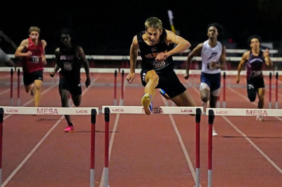 Gilbert High's Vance Nilsson breaks the national high school record in the 300M hurdles during Saturday's AIA state high school track and field championships at Mesa Community College on May 11, 2024.