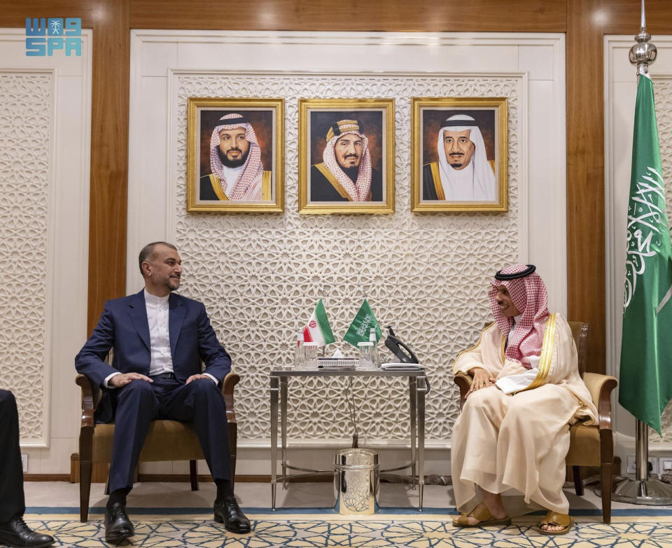 In this handout image released by the state-run Saudi Press Agency, Iranian Foreign Minister Hossein Amirabdollahian, left, meets Saudi Foreign Minister Prince Faisal bin Farhan in Riyadh, Saudi Arabia, Thursday, Aug. 17, 2023. Iran's foreign minister traveled to Saudi Arabia on Thursday, marking the first trip to the kingdom by Tehran's top diplomat in years after the two nations reached a détente with Chinese mediation. (Abdulrahman al-Abdulsalam/Saudi Press Agency via AP)