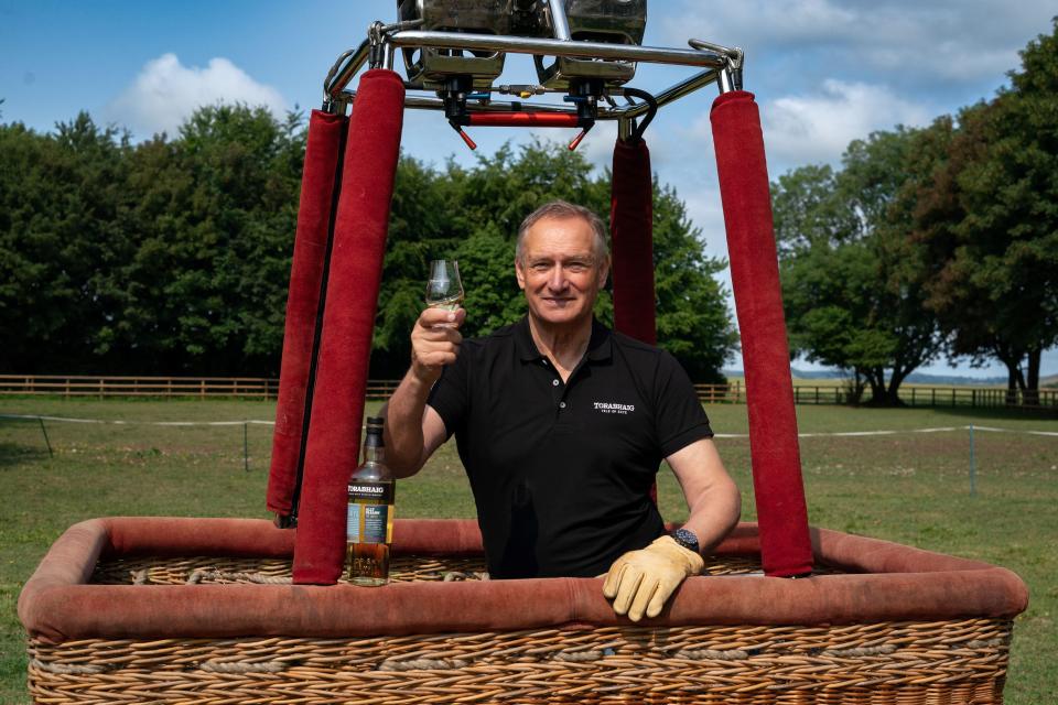 Sir David Hempleman-Adams of Box, Wiltshire in the United Kingdom holds up a glass of Torabhaig Scotch whiskey from the comfort of a balloon. The 66-year-old adventurer said he hasn't been able to drink in two months in preparation for a five-day hydrogen gas balloon journey across the Atlantic Ocean. Based on the Isle of Skye, Scotland, Torabhaig is the trip's sponsor. Its founder, Swedish billionaire Frederik Paulsen, is among the men who will be on the flight.