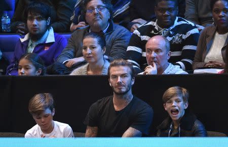 Tennis - Barclays ATP World Tour Finals - O2 Arena, London - 21/11/15 (L - R) Cruz Beckham, David Beckham and Romeo Beckham during the match Action Images via Reuters / Tony O'Brien Livepic