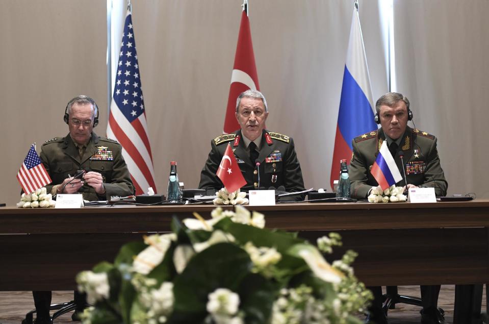 Turkey's Chief of Staff Gen. Hulusi Akar, center, U.S. Chairman of the Joint Chiefs of Staff Gen. Joseph Dunford, left, and Russia's Chief of Staff Gen. Valery Gerasimov attend a meeting in the Mediterranean coastal city of Antalya, Turkey, Tuesday, March 7, 2017. Turkey's military says the Turkish, U.S. and Russian chiefs of military staff are meeting in southern Turkey to discuss developments in Syria and Iraq. The meeting comes amid renewed Turkish threats to hit U.S.-backed Syrian Kurdish targets in the northern Syrian city of Manbij. (Turkish Military, Pool Photo via AP)