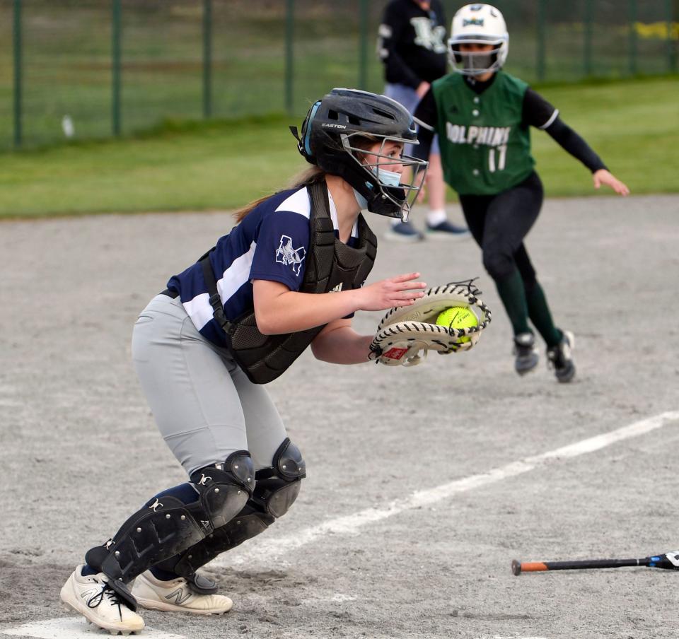 Monomoy catcher AJ Gates forces D-Y runner Charleigh Hicks at home before throwing out the runner at first.