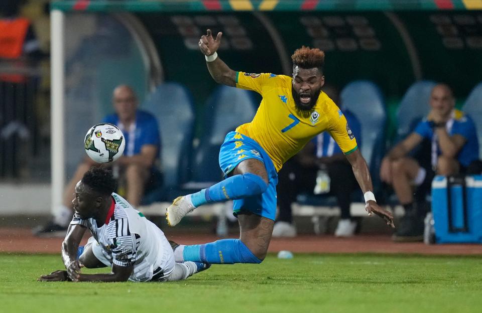 Gabon's Aaron Boupendza, right, is tackled by Ghana's Andy Yiadom, during the African Cup of Nations 2022 group C soccer match between Gabon and Ghana at the Ahmadou Ahidjo stadium in Yaounde, Cameroon, Friday, Jan. 14, 2022. (AP Photo/Themba Hadebe)