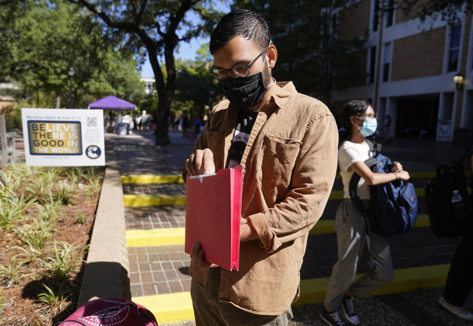 Hector Andres, an organizer with the Latino empowerment group JOLT, prepares for a community outreach and canvassing in Arlington, Texas, Wednesday, Sept. 22, 2021. Texas this week will begin redrawing congressional lines, and Latino advocates and officeholders say it's time to correct past wrongs. The state's explosive population growth over the past decade, half of which comes from Latinos, has earned it two new congressional seats. (AP Photo/LM Otero)