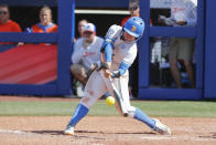 UCLA's Savannah Pola (5) takes an at-bat during the sixth inning of an NCAA softball Women's College World Series game against Florida on Sunday, June 5, 2022, in Oklahoma City. (AP Photo/Alonzo Adams)