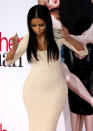 Nicki Minaj looks like she's showing off some dance moves... and her insane hour-glass figure