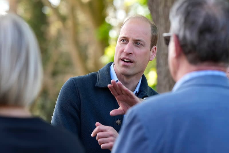 Britain's Prince William is greeted as he arrives for a visit to Surplus to Supper, in Sunbury-on-Thames, Surrey, England, Thursday, April 18, 2024. The Prince visited Surplus to Supper, a surplus food redistribution charity, to learn about its work bridging the gap between food waste and food poverty across Surrey and West London. | Alastair Grant