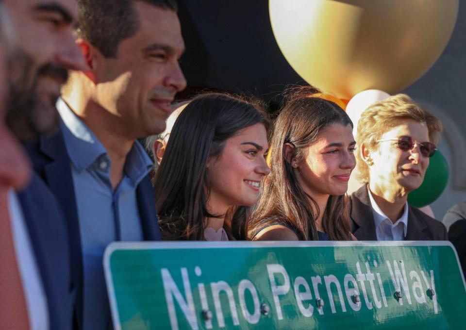 Coral Gables Mayor Vince Lago, left, and Tatiana and Katerina Pernetti at the ceremony in 2023 renaming part of Aragon Avenue “Nino Pernetti Way” in honor of their father Nino.