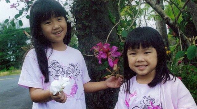 Linnie Ikeda (pictured right with her sister as children) did not suffer symptoms of Gardner-Dimaond syndrome until her late teens. Photo: Facebook