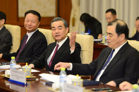 Chinese Foreign Minster and State Counselor Wang Yi, second from left, attends a meeting with Philippine Foreign Affairs Secretary Alan Peter Cayetano at the Diaoyutai State Guesthouse in Beijing, China March 21, 2018. Parker Song/Pool via REUTERS