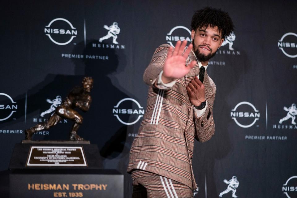 USC quarterback Caleb Williams poses for photos after winning the Heisman Trophy on Dec. 10, 2022.