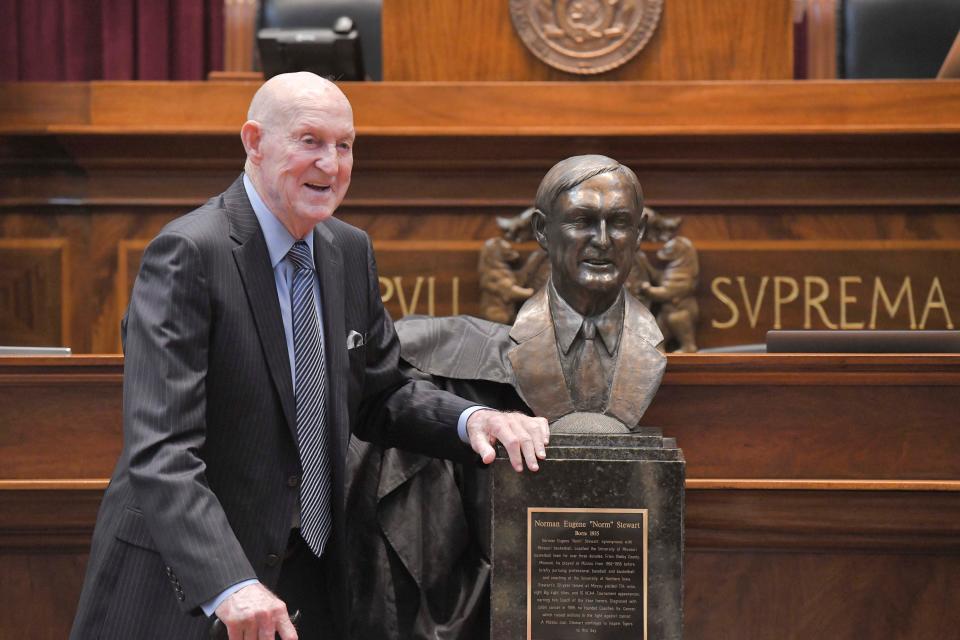 Former Missouri basketball coach Norm Stewart stands beside his bust during his induction ceremony into the Hall of Famous Missourians on Wednesday in Jefferson City.