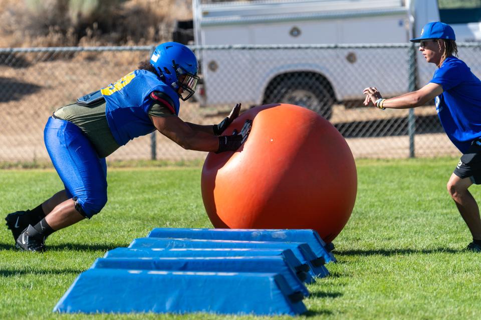 Serrano's David Green participates in a drill during a recent summer football practice at the school. Serrano begins the season at home against Eisenhower on Aug. 18.