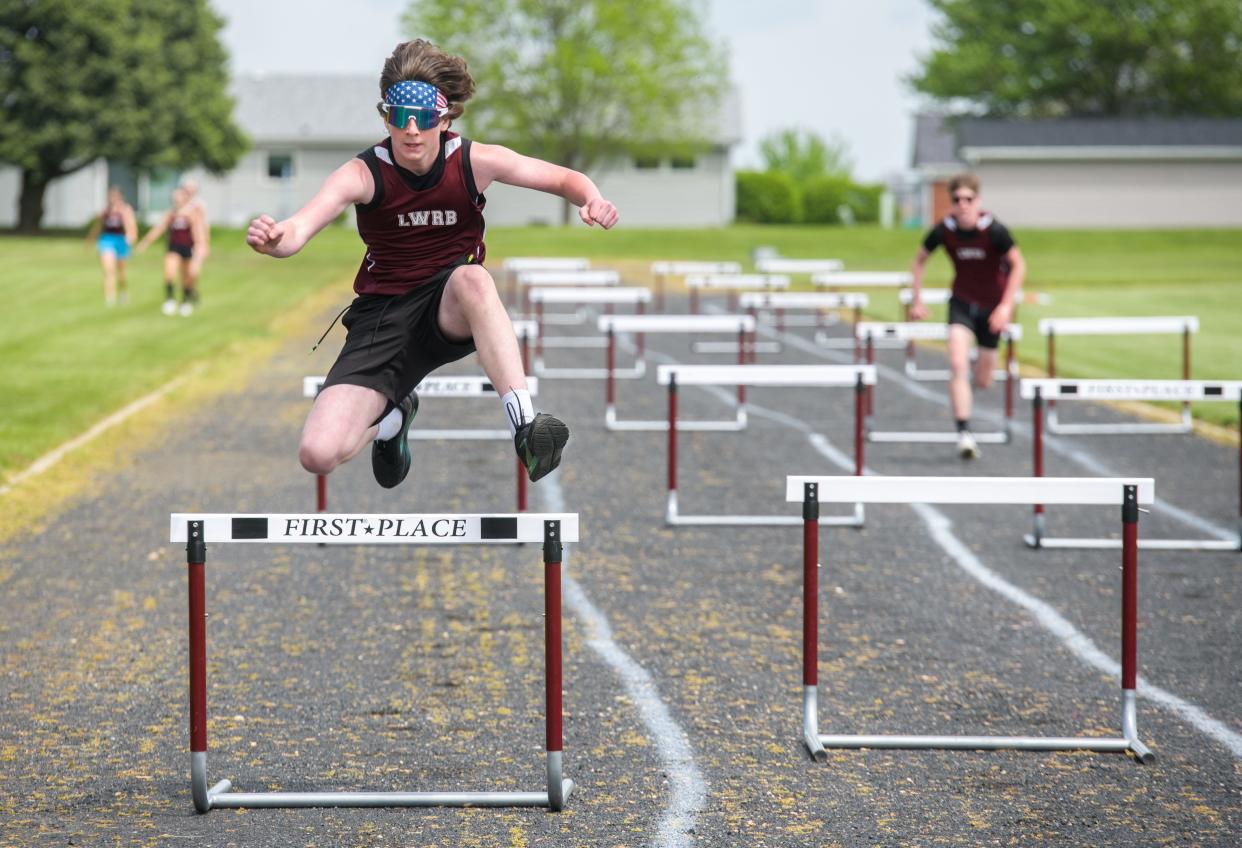 LWRB's Tristan Burle leaps to victory in the co-ed 4X100-meter shuttle hurdle relay during the first annual Cinder Classic track and field meet Saturday, May 4, 2024 in Roanoke.
