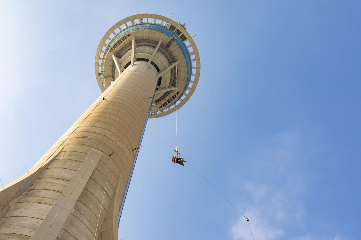 person bungee jumping from Macau Tower, Macau