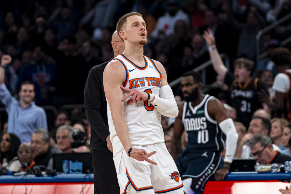 New York Knicks guard Donte DiVincenzo (0) reacts after a 3-point basket during the first half of an NBA basketball game against the Dallas Mavericks in New York, Thursday, Feb. 8, 2024. (AP Photo/Peter K. Afriyie)