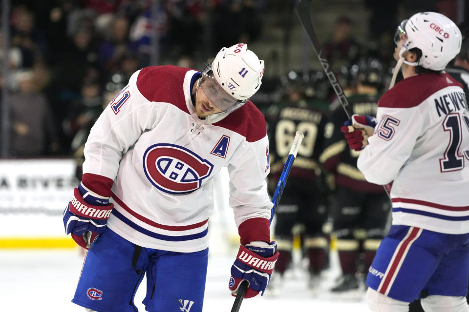 Montreal Canadiens right wing Brendan Gallagher (11) and center Alex Newhook skate off the ice after the team's loss to the Arizona Coyotes in an NHL hockey game Thursday, Nov. 2, 2023, in Tempe, Ariz. (AP Photo/Ross D. Franklin)