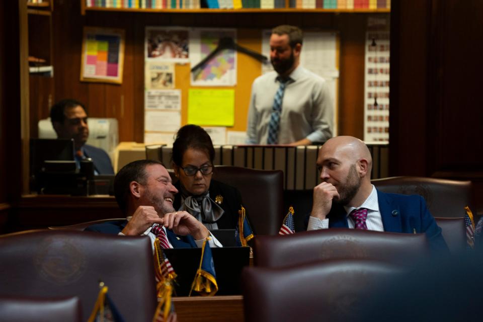 Rep. Chuck Goodrich, R-Noblesville, laughs with Rep. Robb Greene, R-Shelbyville, Wednesday, March 6, 2024, at the Indiana Statehouse in Indianapolis.