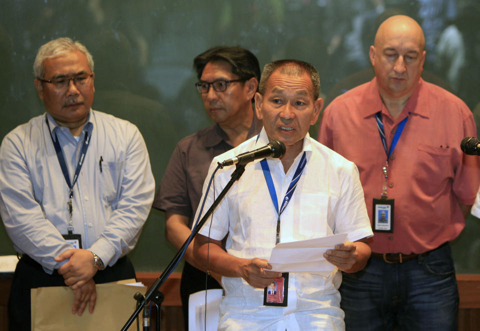 Malaysian Airlines Group Chief Executive Ahmad Jauhari Yahyain, front, speaks during a press conference at a hotel in Sepang, outside Kuala Lumpur, Malaysia, Saturday, March 8, 2014. A Malaysia Airlines Boeing 777-200 carrying 239 people lost contact with air traffic control early Saturday morning on a flight from Kuala Lumpur to Beijing, and international aviation authorities still hadn't located the jetliner several hours later. (AP Photo/Lai Seng Sin)