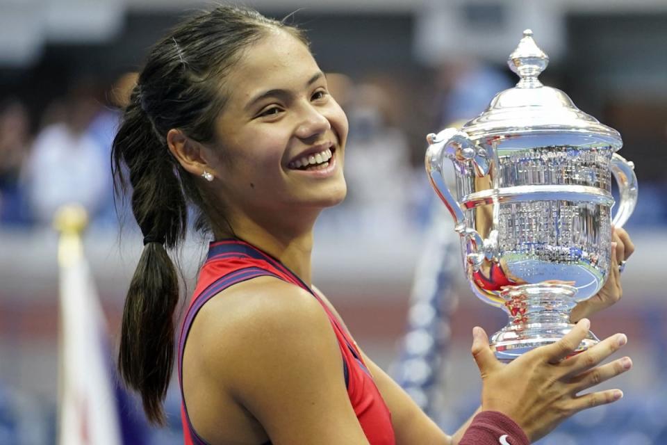 Emma Raducanu celebrates with the US Open trophy in 2021  (PA Media)