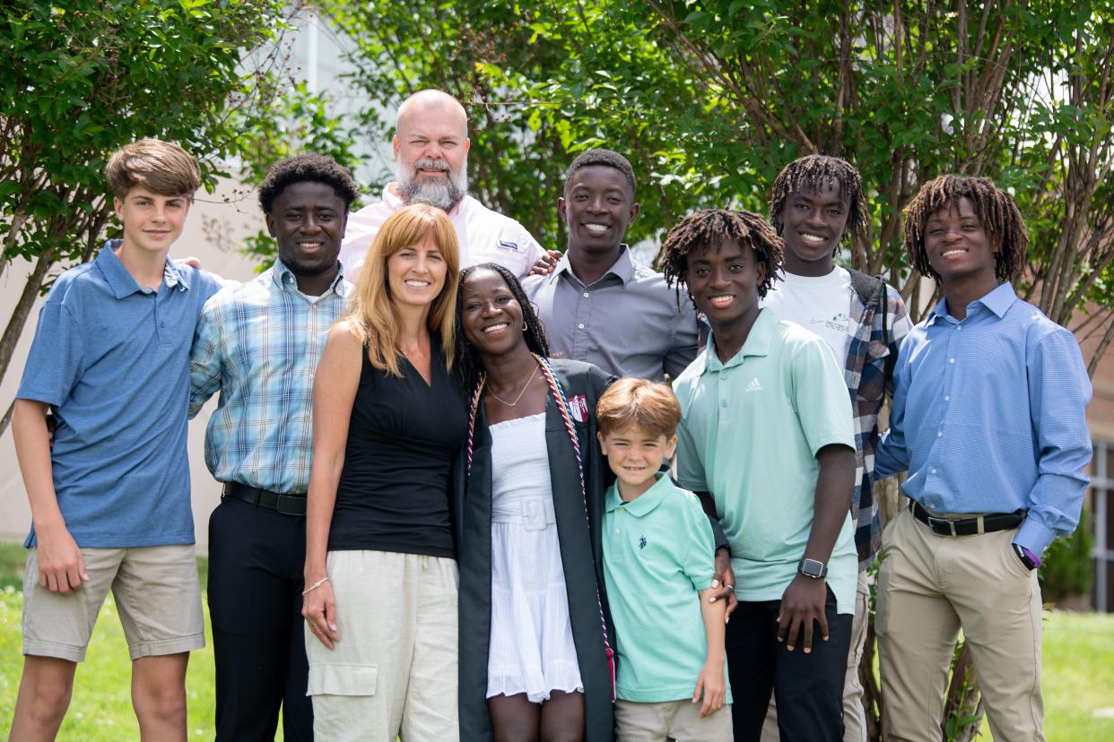 Mike and Hayley Jones pose with eight of their 11 children at the James E. Ward Agriculture Center in Lebanon, Tenn., after their daughter, Gabrielle, graduated from Cumberland University on May 4, 2024. From left, Tucker, 15, Michael, 26, Gabrielle, 22, Tobiah (‘TJ’), 8, Samuel, 25, Judah, 18, Zion, 16, and Levi, 21.